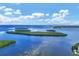 Aerial view of waterfront property with lush landscaping and beautiful water views at 4350 Chatham Dr # E106, Longboat Key, FL 34228