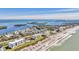 Aerial view of beachfront community with ocean and residential buildings at 4350 Chatham Dr # E106, Longboat Key, FL 34228