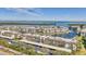 Aerial view of waterfront community; buildings, canal, and ocean visible at 4350 Chatham Dr # 106, Longboat Key, FL 34228