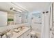 Clean bathroom with tub, shower, and updated vanity at 4350 Chatham Dr # 106, Longboat Key, FL 34228