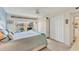 Bright bedroom with water views and a comfortable bed, featuring built-in closet at 4350 Chatham Dr # 106, Longboat Key, FL 34228