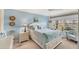 Cozy bedroom with water views, a comfortable bed, and ample natural light at 4350 Chatham Dr # 106, Longboat Key, FL 34228