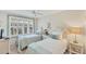 Guest bedroom with twin beds and large windows at 4350 Chatham Dr # E106, Longboat Key, FL 34228