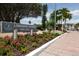 Longboat Harbour community entrance with landscaping and address signage at 4350 Chatham Dr # 106, Longboat Key, FL 34228