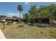 Landscaped courtyard with building exterior view at 4350 Chatham Dr # 106, Longboat Key, FL 34228