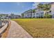 Complex exterior with walkway and waterfront views at 4350 Chatham Dr # 106, Longboat Key, FL 34228