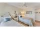 Guest bedroom with twin beds, ceiling fan, and serene decor at 4350 Chatham Dr # 106, Longboat Key, FL 34228