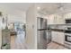 Kitchen with stainless steel appliances and granite countertops at 4350 Chatham Dr # 106, Longboat Key, FL 34228