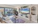 Bright living room with water views and comfortable seating at 4350 Chatham Dr # 106, Longboat Key, FL 34228