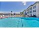 Refreshing community pool area with lounge chairs at 4350 Chatham Dr # E106, Longboat Key, FL 34228