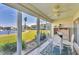 Sunroom boasts water views and glass sliders at 4350 Chatham Dr # 106, Longboat Key, FL 34228