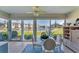 Sunroom with water views and glass sliders at 4350 Chatham Dr # 106, Longboat Key, FL 34228