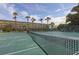 Well-maintained tennis court with surrounding landscape at 4350 Chatham Dr # E106, Longboat Key, FL 34228