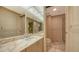 Elegant bathroom with marble vanity and shower at 455 Longboat Club Rd # 305, Longboat Key, FL 34228