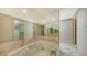 Primary bathroom with a large jacuzzi tub and walk-in closet at 455 Longboat Club Rd # 305, Longboat Key, FL 34228