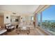 Living room with ocean views and comfortable seating at 455 Longboat Club Rd # 305, Longboat Key, FL 34228