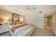 Large main bedroom with a comfortable bed and ensuite bathroom at 455 Longboat Club Rd # 305, Longboat Key, FL 34228