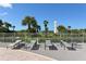 Spacious pool deck with lounge chairs and ocean view at 455 Longboat Club Rd # 305, Longboat Key, FL 34228