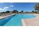 Resort-style pool with plenty of lounge chairs at 455 Longboat Club Rd # 305, Longboat Key, FL 34228