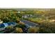 Aerial view of townhouses near a golf course, surrounded by nature at 4850 51St W St # 9106, Bradenton, FL 34210