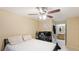 Bright bedroom with a double bed, ceiling fan, and en-suite bathroom at 4850 51St W St # 9106, Bradenton, FL 34210