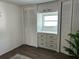 Well-organized bedroom closet with built-in shelves and drawers at 4915 Winged Foot Ave, Sarasota, FL 34234