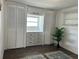 Bedroom with built-in shelving and ample closet space at 4915 Winged Foot Ave, Sarasota, FL 34234