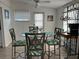 Dining area with round glass table and four chairs at 4915 Winged Foot Ave, Sarasota, FL 34234