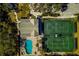 Aerial view showing clubhouse, pool, and tennis courts at 5250 Manorwood Dr # 4A, Sarasota, FL 34235