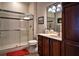 Elegant bathroom with large shower and modern vanity at 5250 Manorwood Dr # 4A, Sarasota, FL 34235