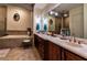 Elegant bathroom with double vanity, soaking tub, and shower at 5250 Manorwood Dr # 4A, Sarasota, FL 34235