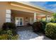 Inviting clubhouse entrance with covered porch, landscaping, and a welcoming atmosphere at 5250 Manorwood Dr # 4A, Sarasota, FL 34235