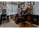 Large home office with ample desk space and wall of windows at 5250 Manorwood Dr # 4A, Sarasota, FL 34235