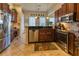 Modern kitchen with stainless steel appliances and granite counters at 5250 Manorwood Dr # 4A, Sarasota, FL 34235