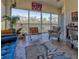 Living room with large windows and access to a balcony at 5250 Manorwood Dr # 4A, Sarasota, FL 34235