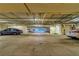 Ample parking garage with designated spaces for cars at 5250 Manorwood Dr # 4A, Sarasota, FL 34235