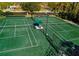 Two well-maintained tennis courts ideal for recreation at 5250 Manorwood Dr # 4A, Sarasota, FL 34235