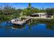 Aerial view showing house, dock, and canal at 5508 Dinah Ln, Sarasota, FL 34231