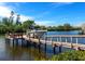 Private wooden dock and boat lift on calm waters at 5508 Dinah Ln, Sarasota, FL 34231