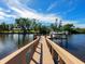 Private wooden dock with boat lift on the canal at 5508 Dinah Ln, Sarasota, FL 34231