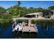 Private dock with boat lift, perfect for enjoying the waterfront lifestyle at 5508 Dinah Ln, Sarasota, FL 34231