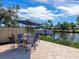 Small patio set on the dock overlooking the water at 5508 Dinah Ln, Sarasota, FL 34231