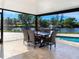 Waterfront patio features a dining table with canal view at 5508 Dinah Ln, Sarasota, FL 34231