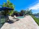 Relaxing pool area with lounge chairs and patio, overlooking the canal at 5508 Dinah Ln, Sarasota, FL 34231