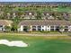 Expansive aerial view of the condos overlooking the golf course, highlighting the community's desirable location and manicured landscapes at 5527 Palmer Cir # 205, Bradenton, FL 34211