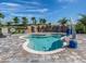 Community hot tub with a chair lift and waterfall feature at 5527 Palmer Cir # 205, Bradenton, FL 34211