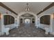 Elegant lobby area with seating, arched doorways, decorative lighting, and tile flooring at 5527 Palmer Cir # 205, Bradenton, FL 34211