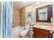 Bathroom with shower-tub combo, wood vanity and neutral walls at 559 Bahia Beach Blvd, Ruskin, FL 33570