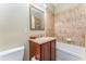 Bathroom featuring a vanity with decorative mirror and combined shower and bathtub at 559 Bahia Beach Blvd, Ruskin, FL 33570