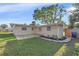 A view of the home's backyard, including a small patio at 5713 Saint Louis Ave, Sarasota, FL 34233